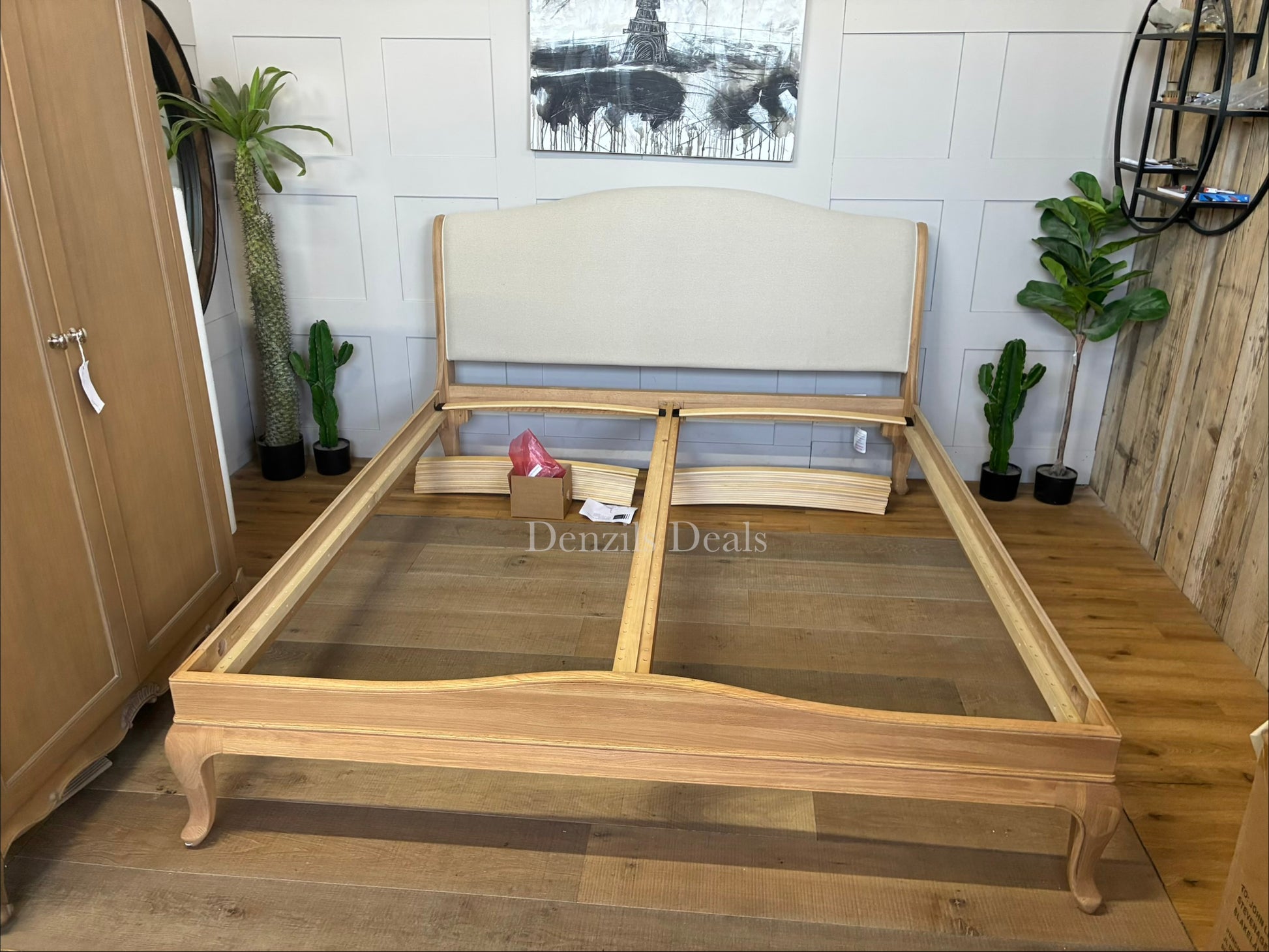 A high-quality John Lewis Louis oak sleigh bed frame in a super king size, featuring a classic curved headboard and footboard with a smooth, natural honey-toned wood grain finish.