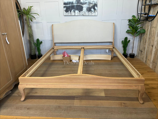 A high-quality John Lewis Louis oak sleigh bed frame in a super king size, featuring a classic curved headboard and footboard with a smooth, natural honey-toned wood grain finish.