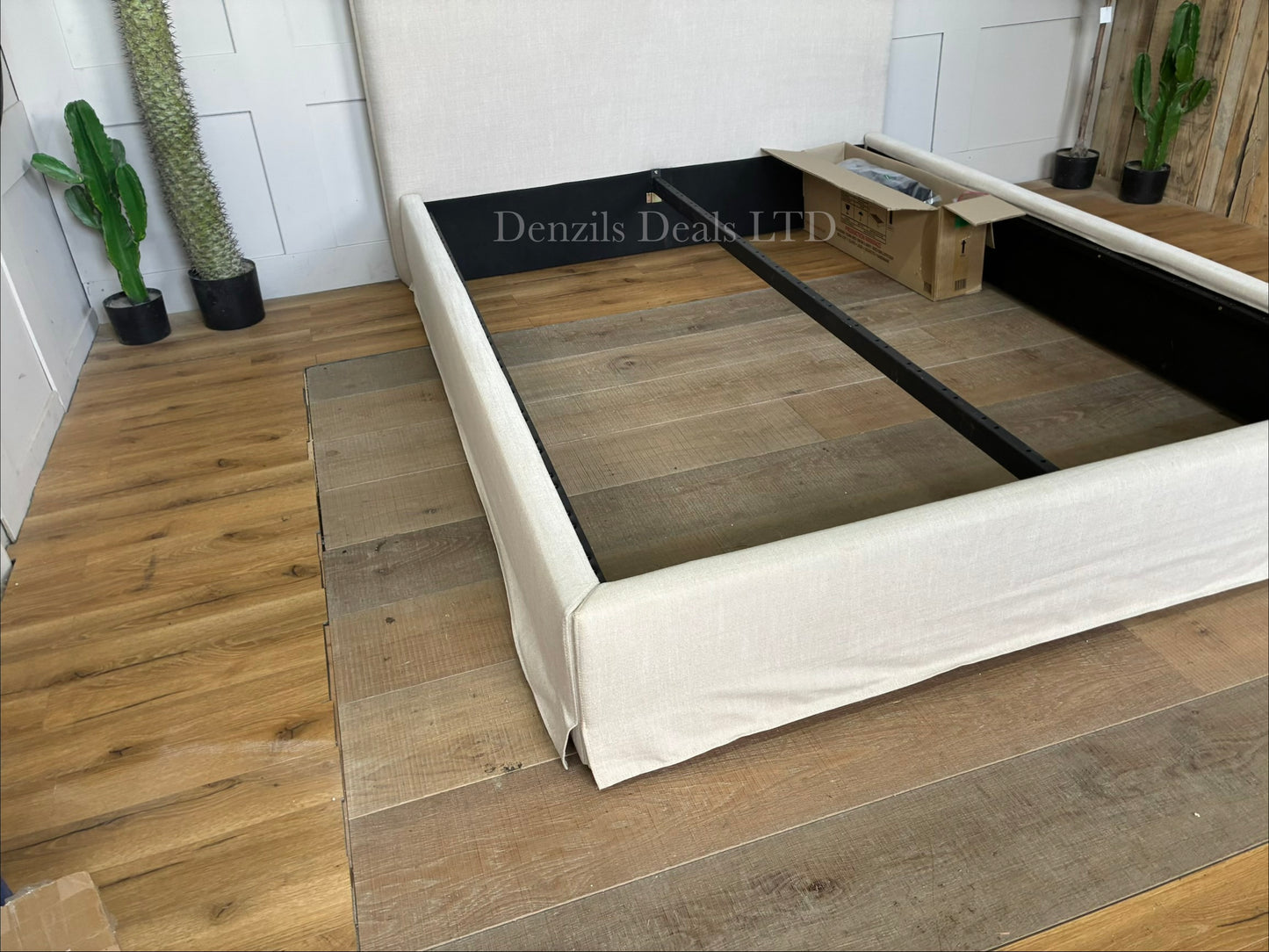 John Lewis Relax Rustic king-size bed frame in natural beige fabric, featuring a large padded headboard with loose-fitting upholstery