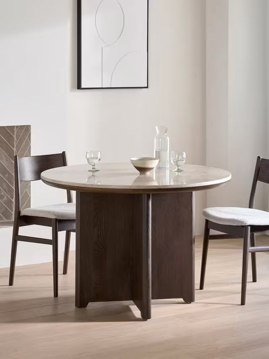 John Lewis Ritz round marble dining table in brown with a thick wooden pedestal base.