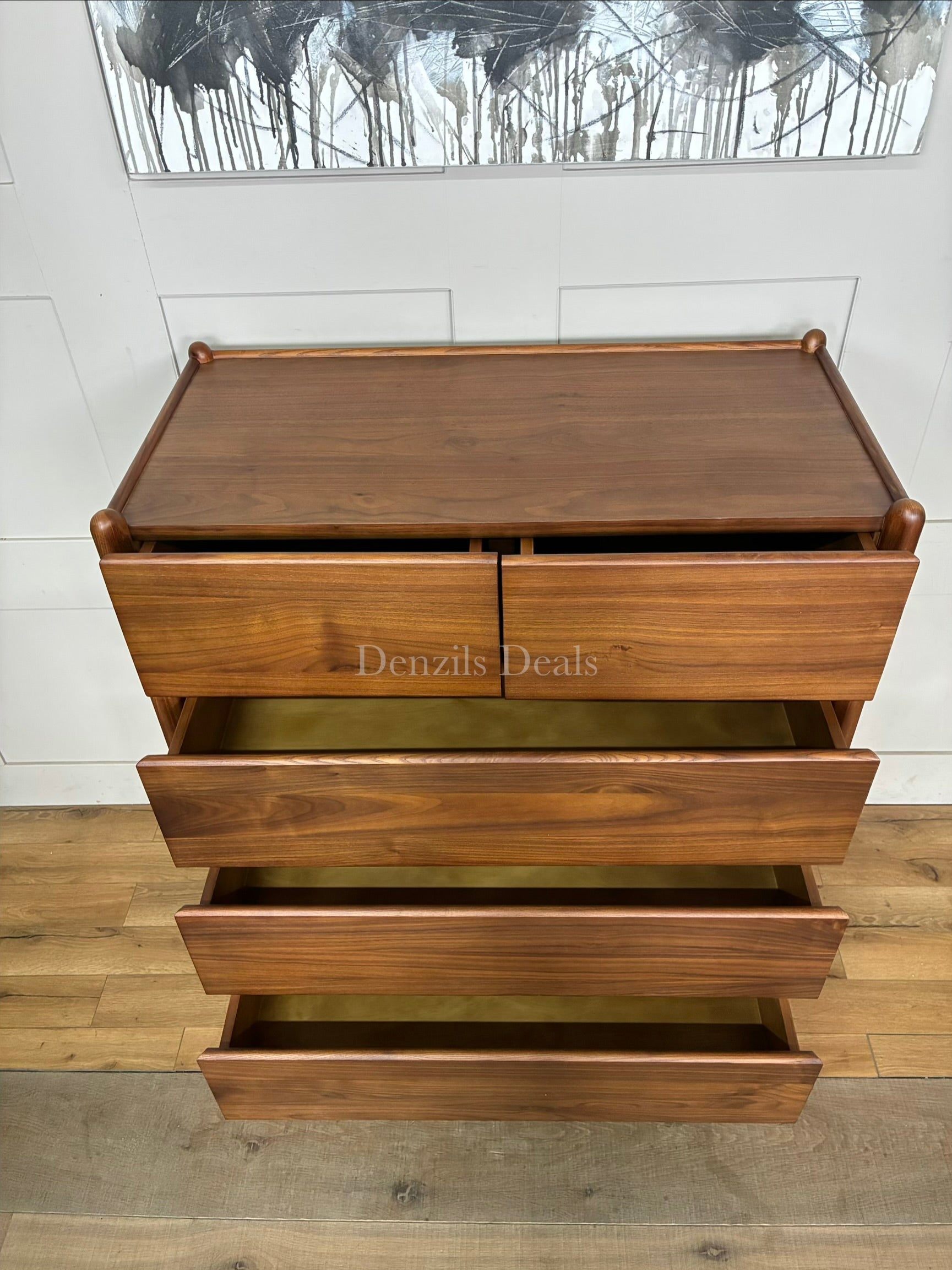 John Lewis Scandi 5 Drawer Wood Chest, Walnut Finish with five storage drawers and the top surface has a slight tray-edge design so your bedside essentials stay secure. Rounded posts, tapered legs and sleek, handle-less drawers all honour Scandinavian design principles, so it's perfect for keeping your bedroom a calm, uncluttered and simple space.