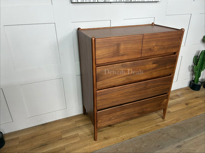 John Lewis Scandi 5 Drawer Wood Chest, Walnut Finish with five storage drawers and the top surface has a slight tray-edge design so your bedside essentials stay secure. Rounded posts, tapered legs and sleek, handle-less drawers all honour Scandinavian design principles, so it's perfect for keeping your bedroom a calm, uncluttered and simple space.