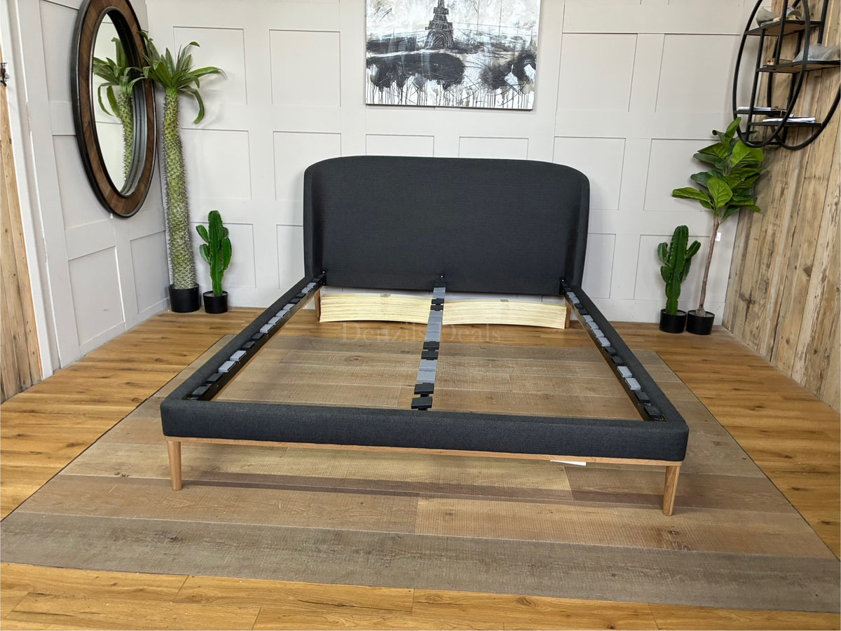 John Lewis Show-Wood King Size Bed Frame upholstered in dark gray brushed tweed charcoal fabric, featuring a curved headboard and natural wood trim base