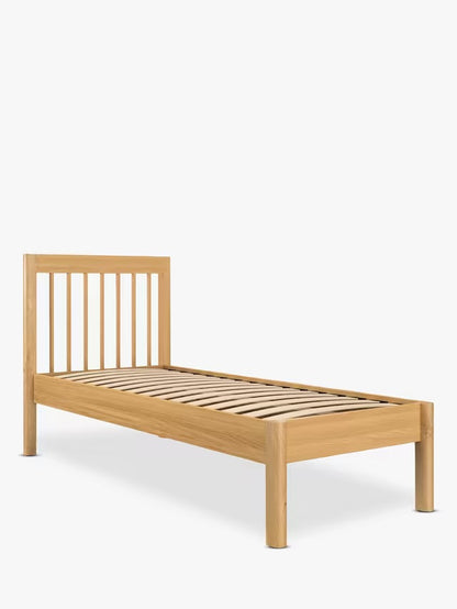 John Lewis Spindle Bed Frame, single, in Natural Oak with slatted headboard and rounded edges.