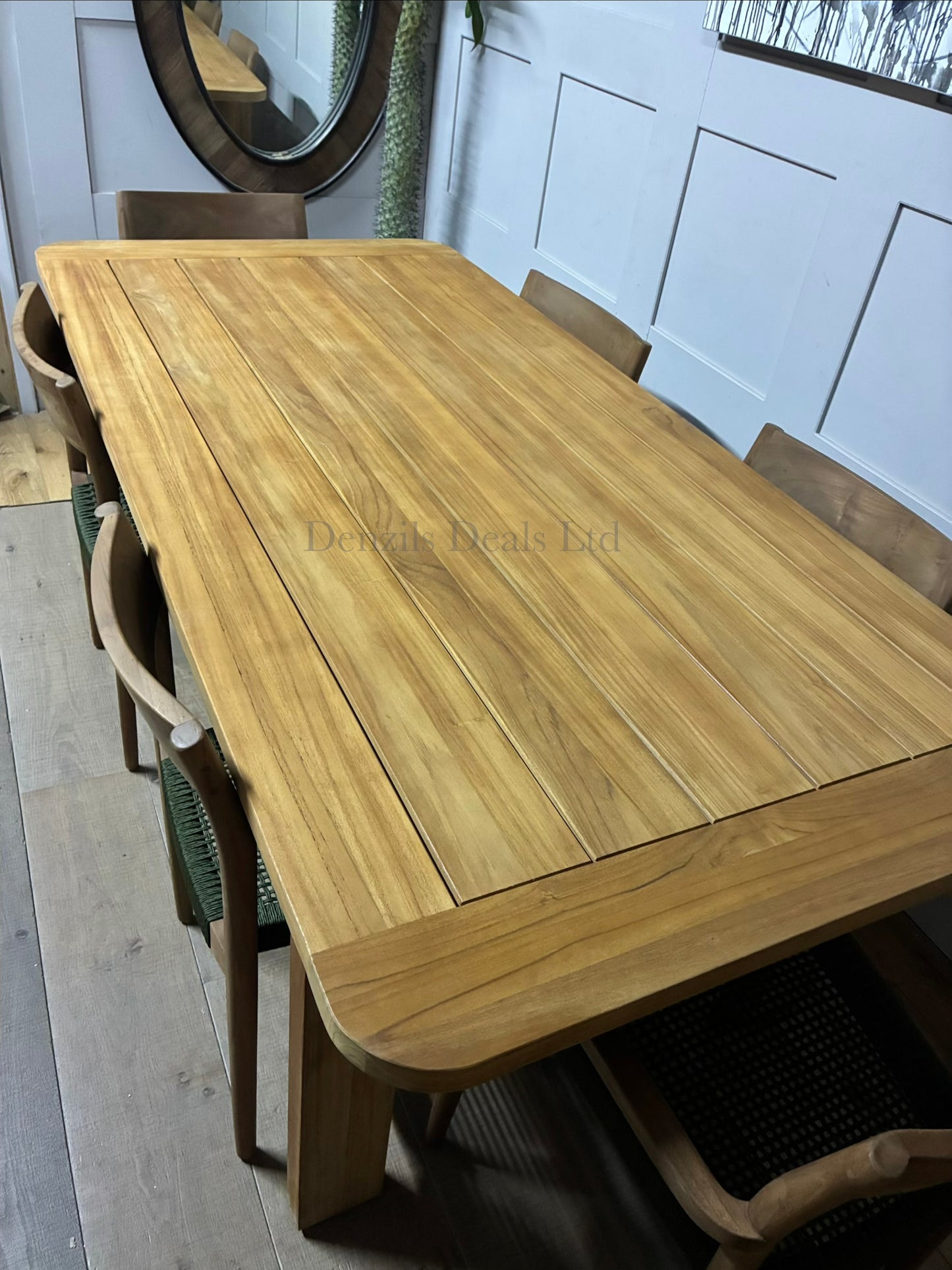 John Lewis Terra 6-seater rectangular garden dining set with modern wooden frames and neutral upholstered seats on a patio close up view 