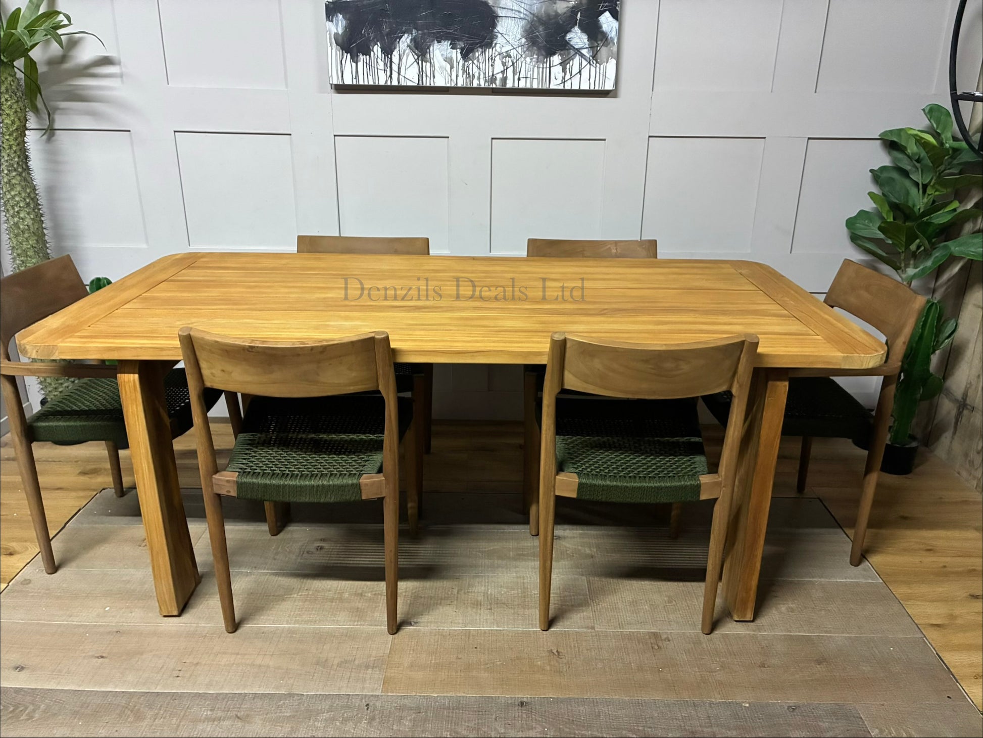 John Lewis Terra rectangular garden dining table with a weather-resistant teak wood frame and gently curved edges, set outdoors on a wooden deck