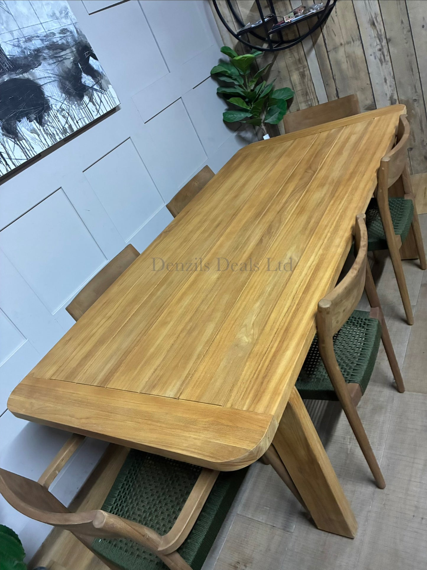 John Lewis Terra teak wood garden table and 6 chairs on a sunlit patio