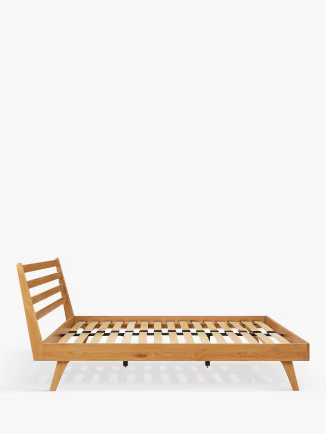 John Lewis X-Ray king size oak wood bed frame featuring a slatted wooden headboard and tapered legs.