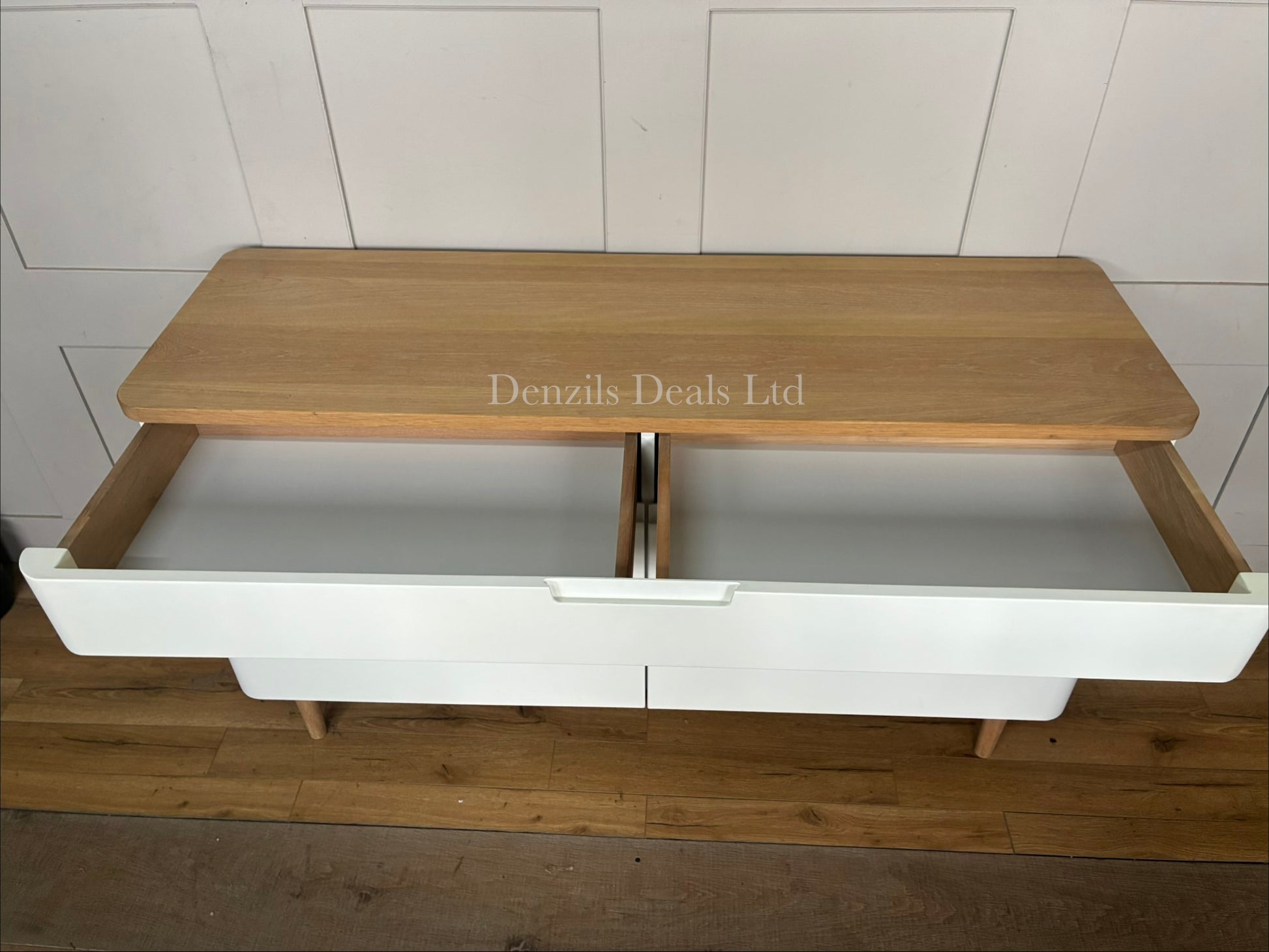John Lewis modern Scandinavian-style wide sideboard featuring a matte white cabinet body, two doors, and a natural solid oak top surface with matching tapered wooden legs.