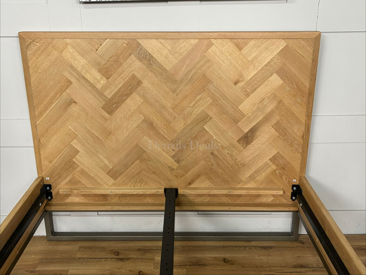 John Lewis oak double bed frame, Estate range, with lacquered finish and slatted base. Close up to headboard 