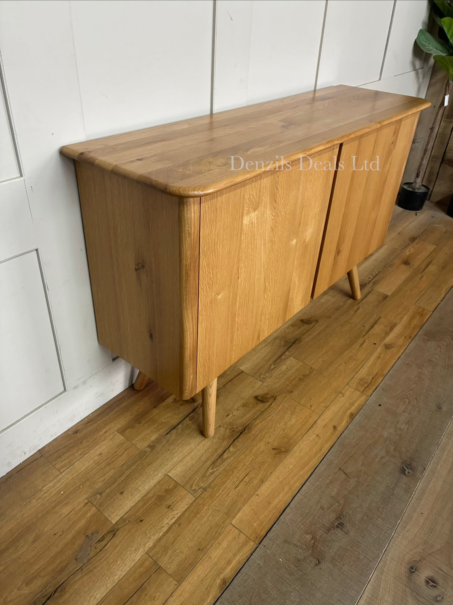 John Lewis Greenwood 2-door sideboard made from solid oak with a light Bianco oil finish.