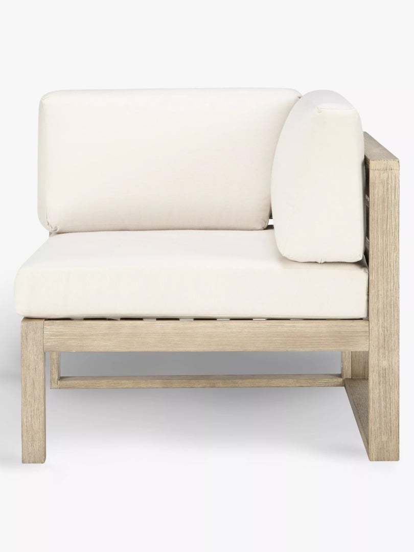 An outdoor corner and modular chairs from the John Lewis St Ives collection, crafted from FSC-certified eucalyptus wood with a slatted back, paired with plush, water-resistant seat and back cushions