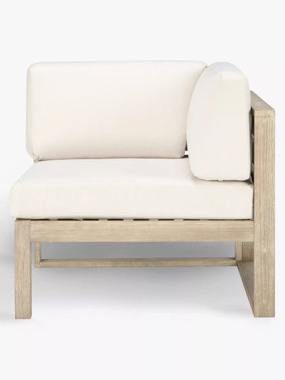 An outdoor corner and modular chairs from the John Lewis St Ives collection, crafted from FSC-certified eucalyptus wood with a slatted back, paired with plush, water-resistant seat and back cushions