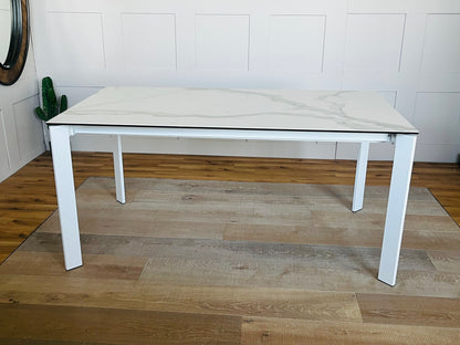 John lewis Modern white rectangular dining table with a smooth ceramic top and a lacquered metal frame, seating up to 6 people.