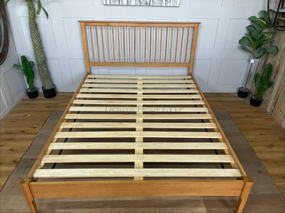 Julian Bowen Cotswold king-size bed frame in natural satin-lacquered oak.