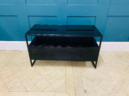 Made.com Kilby compact TV stand in black stain mango wood with a smoked glass top and single drawer