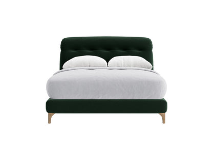 A deep green velvet superking bed frame with a raked, upholstered headboard.