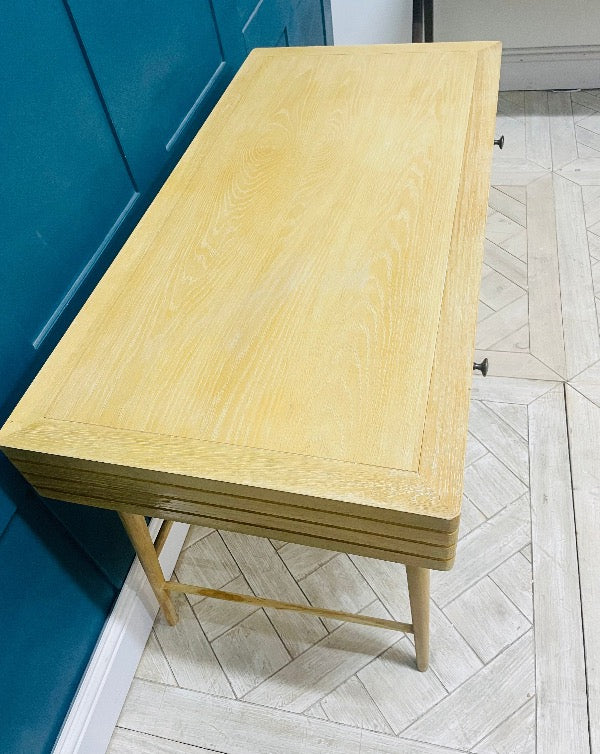 Loaf Clever Bubba Desk in natural oak with a drawer, styled in a minimalist home office setting