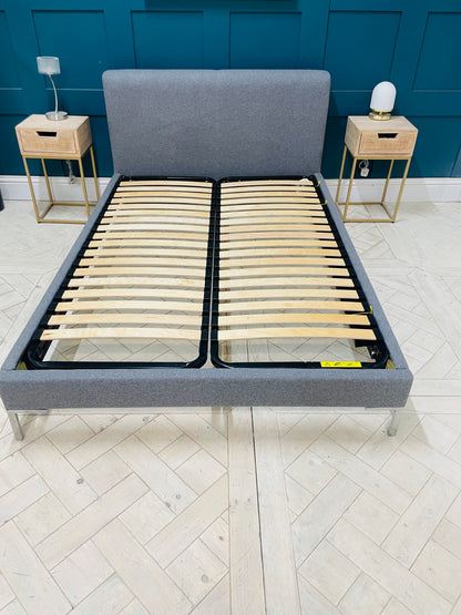 Loaf double bed frame with a contemporary upholstered grey fabric headboard and footboard, featuring a sleek polished chrome frame