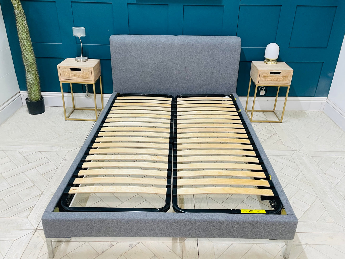 Loaf double bed frame with a contemporary upholstered grey fabric headboard and footboard, featuring a sleek polished chrome frame