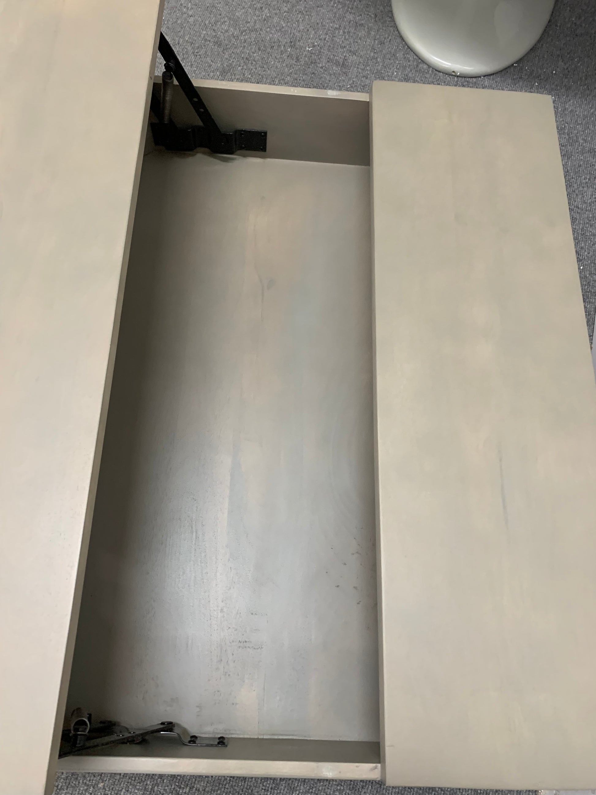 Lomond coffee table with lift-up top extended to reveal hidden storage compartment and industrial metal legs