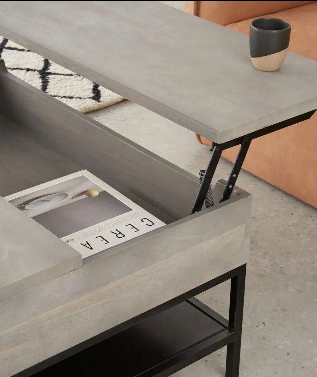 Lomond lift top coffee table in grey washed mango wood featuring a raised top and internal storage