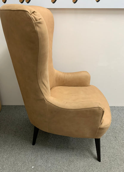 MADE.COM Bodil accent armchair in tan leather with natural wood frame.