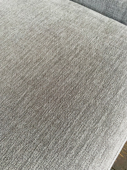 Macro view of the chunky, neutral-toned Opal Putty woven chenille fabric on the John Lewis Laze sofa." 