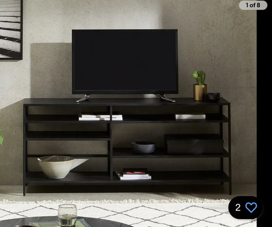 Made.com Munro TV shelving unit in a brushed brass-effect finish, featuring a minimalist industrial design with open storage shelves for media devices and home decor.
