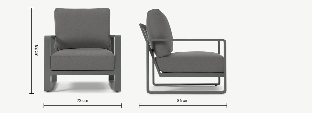 Made.com Topa garden armchair and low coffee table set in solid acacia wood with charcoal grey cushions on a patio.