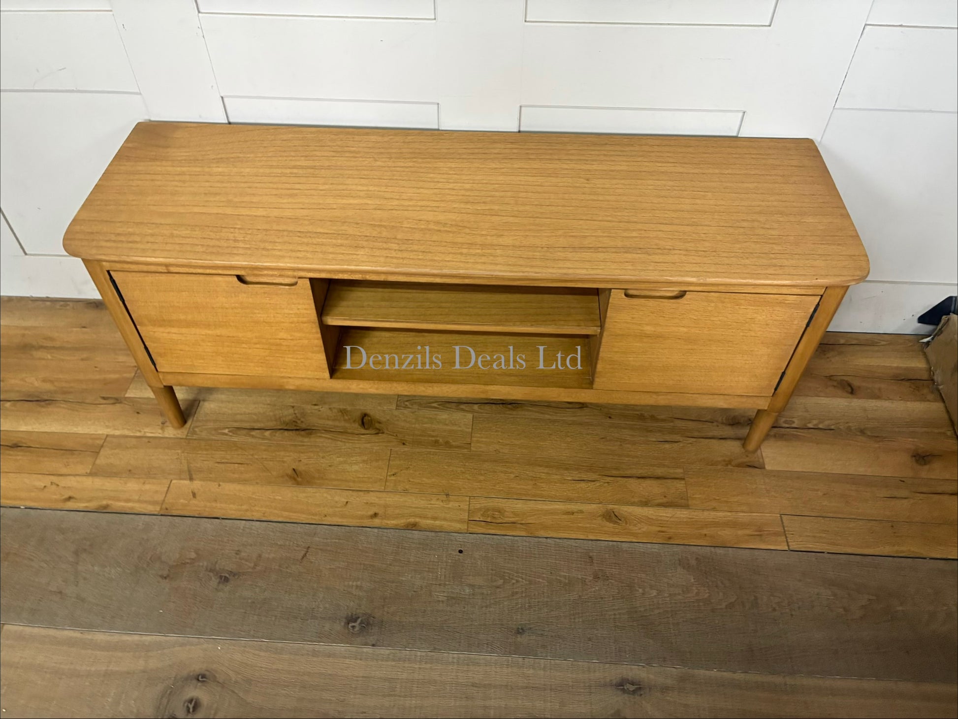 Mid-century modern light oak wooden TV stand and media console featuring clean Scandinavian lines, open shelving, storage compartments, and tapered solid wood legs