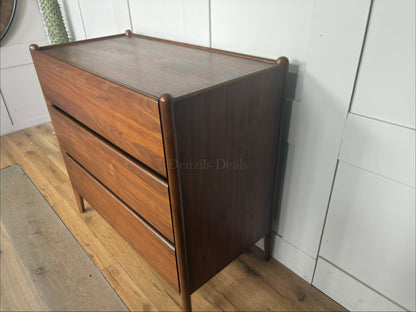 Side view Minimalist mid-century modern 3-drawer dresser by John Lewis, crafted from wood with a warm walnut stain, tray-edge top, and sleek handle-less design."