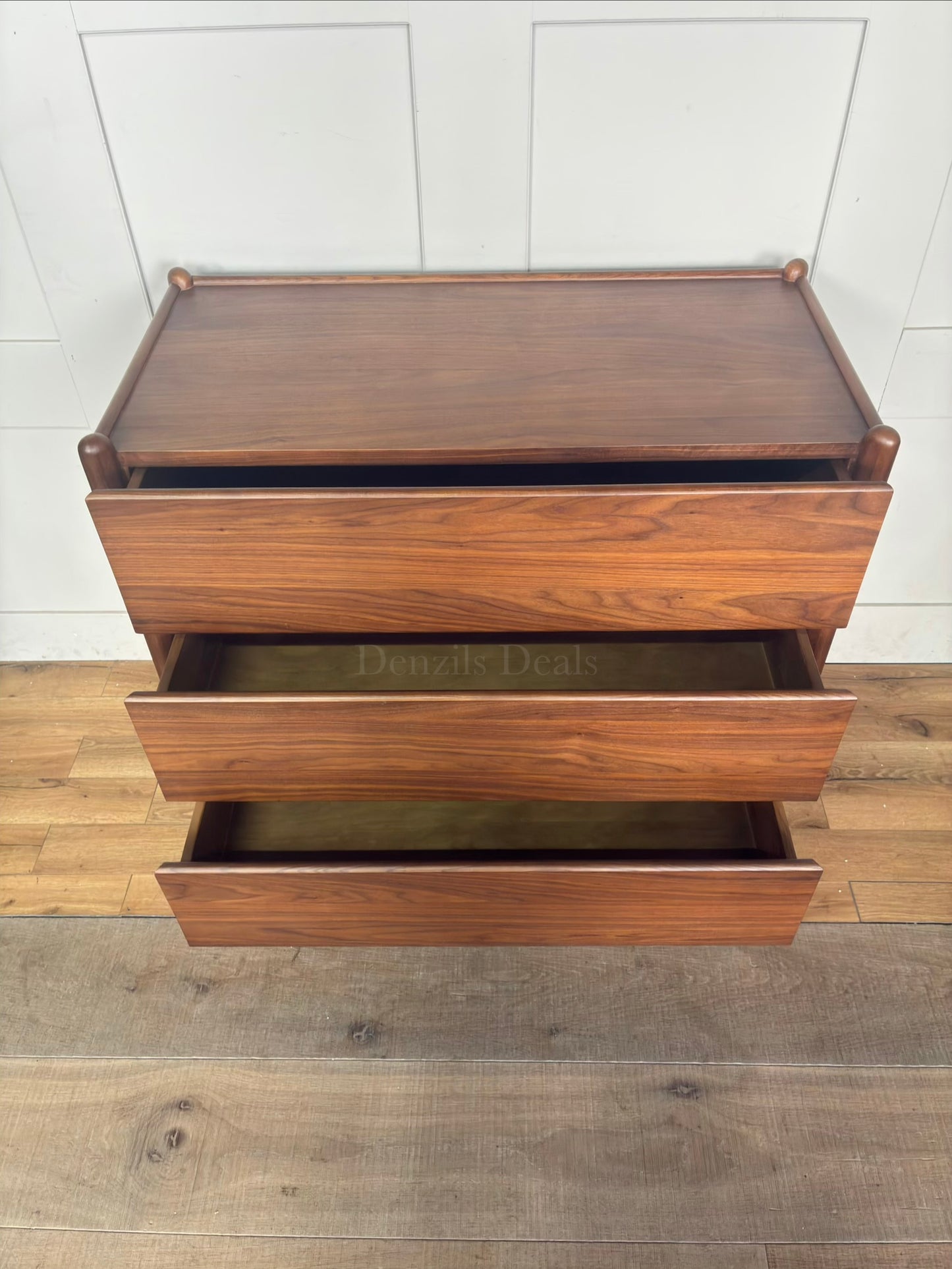 Minimalist mid-century modern 3-drawer dresser by John Lewis, crafted from wood with a warm walnut stain, tray-edge top, and sleek handle-less design."