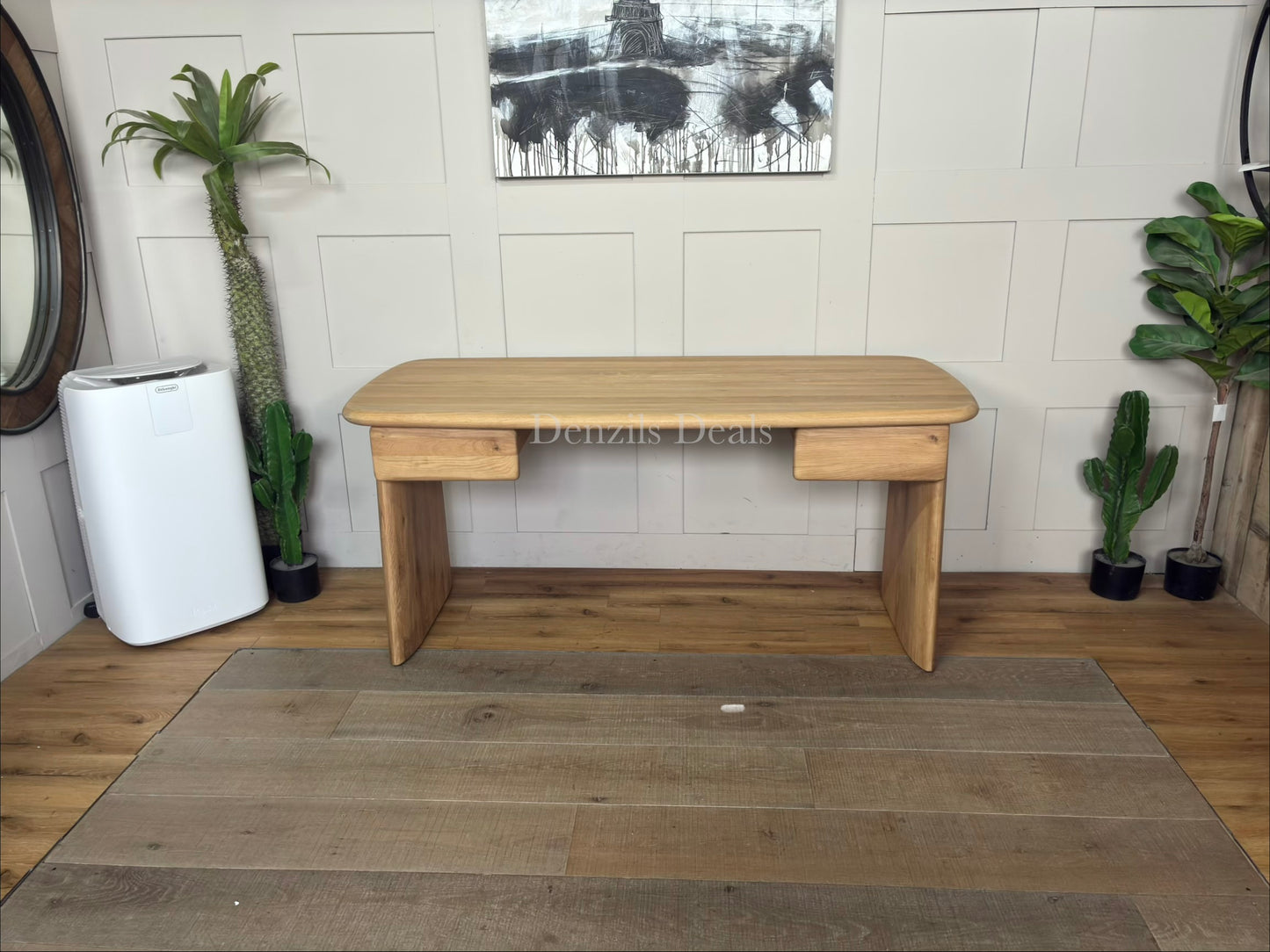 Minimalist oak wood desk featuring an amorphous, curved top and unique sculptural plank legs.