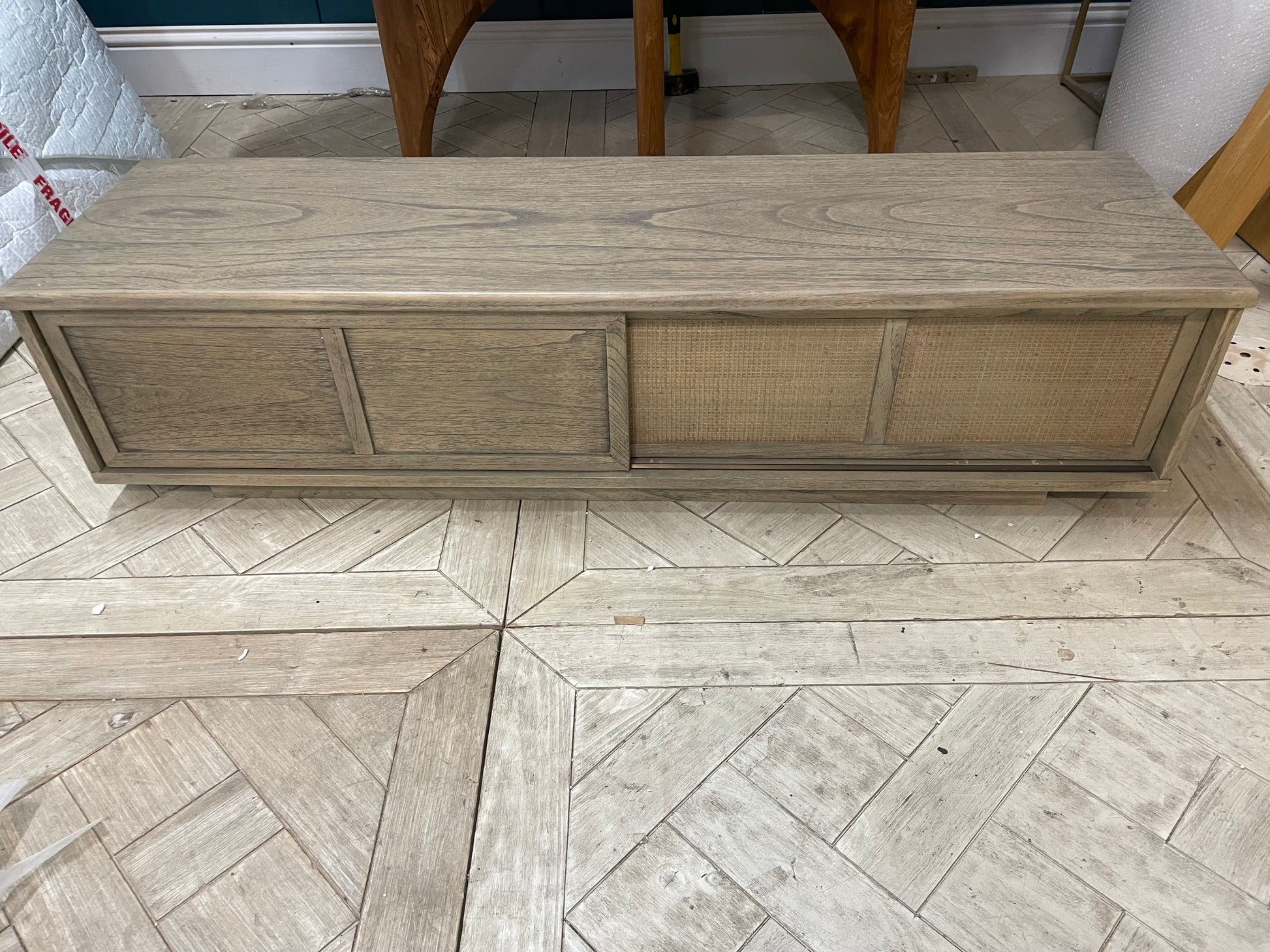 Gallery Direct Craft mid-century modern wooden TV stand featuring a tapered, recessed open-leg underframe, central open media shelves, and side storage drawers
