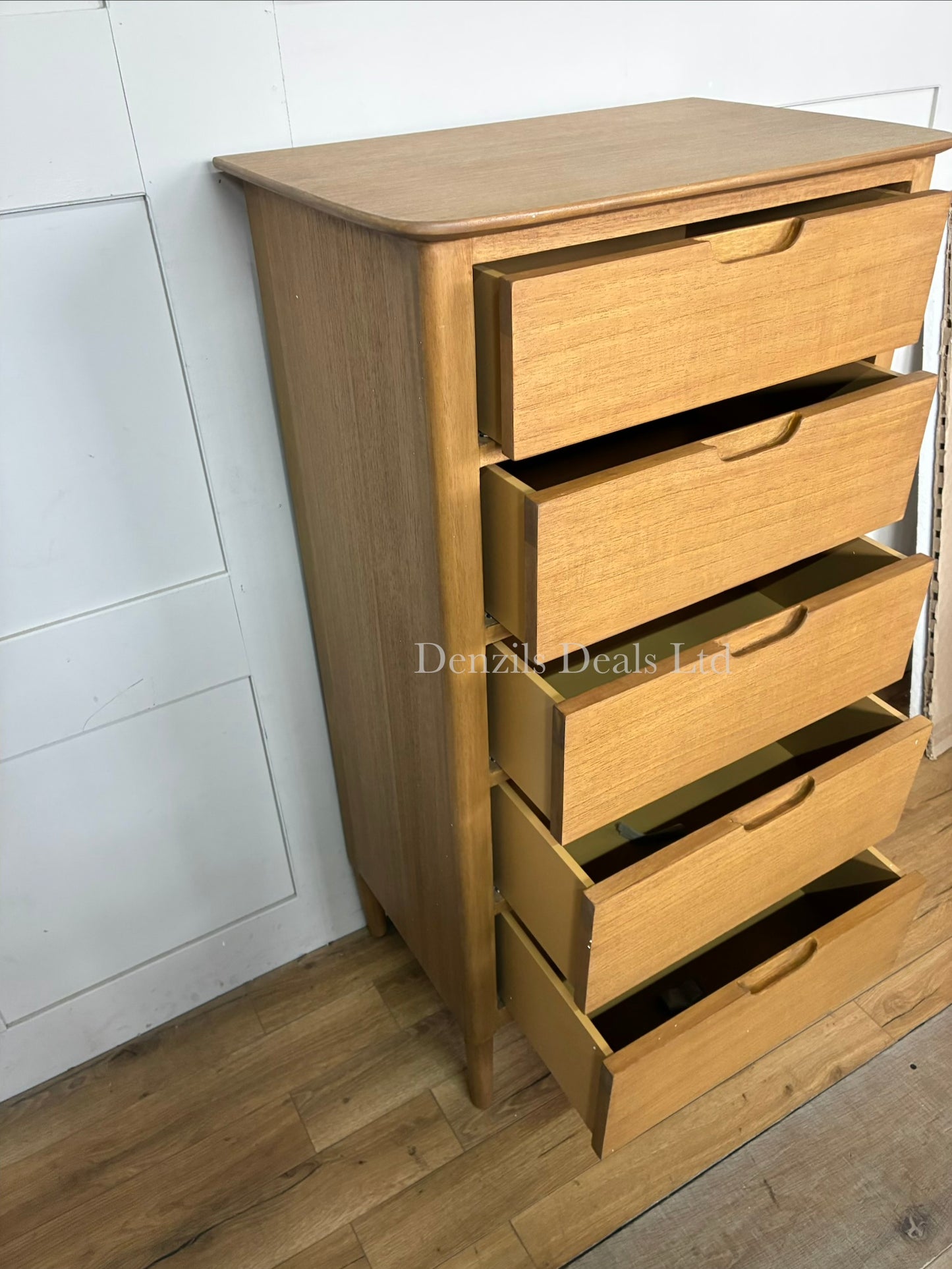 Modern Fishie & Lilly Norway 5-drawer chest of drawers crafted from light solid oak, styled in a minimalist bedroom.
