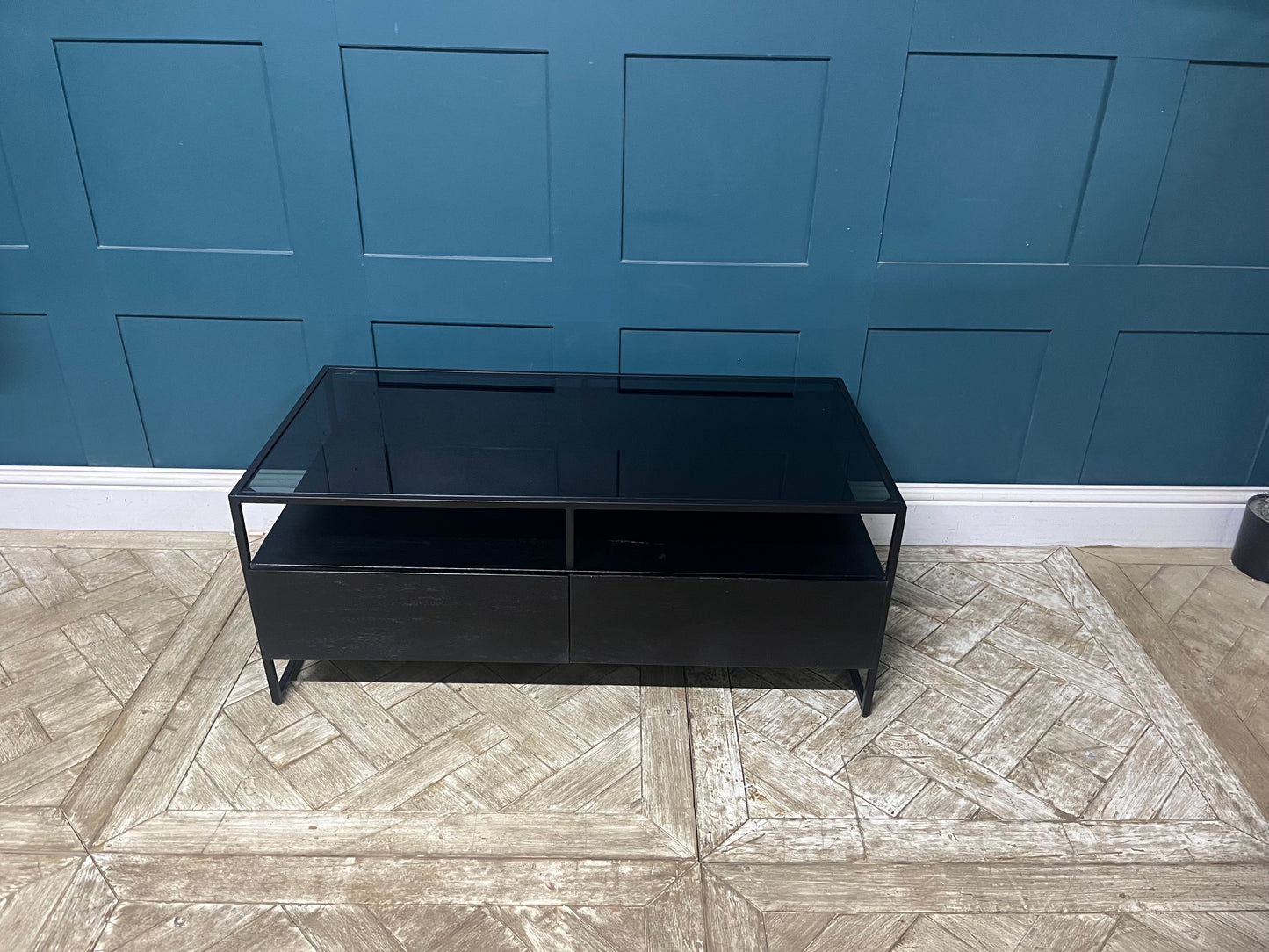 Modern Kilby coffee table by Made.com featuring black metal lines and a sleek smoked glass top