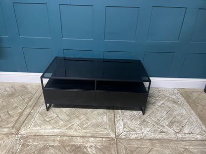Modern Kilby coffee table by Made.com featuring black metal lines and a sleek smoked glass top with storage drawers