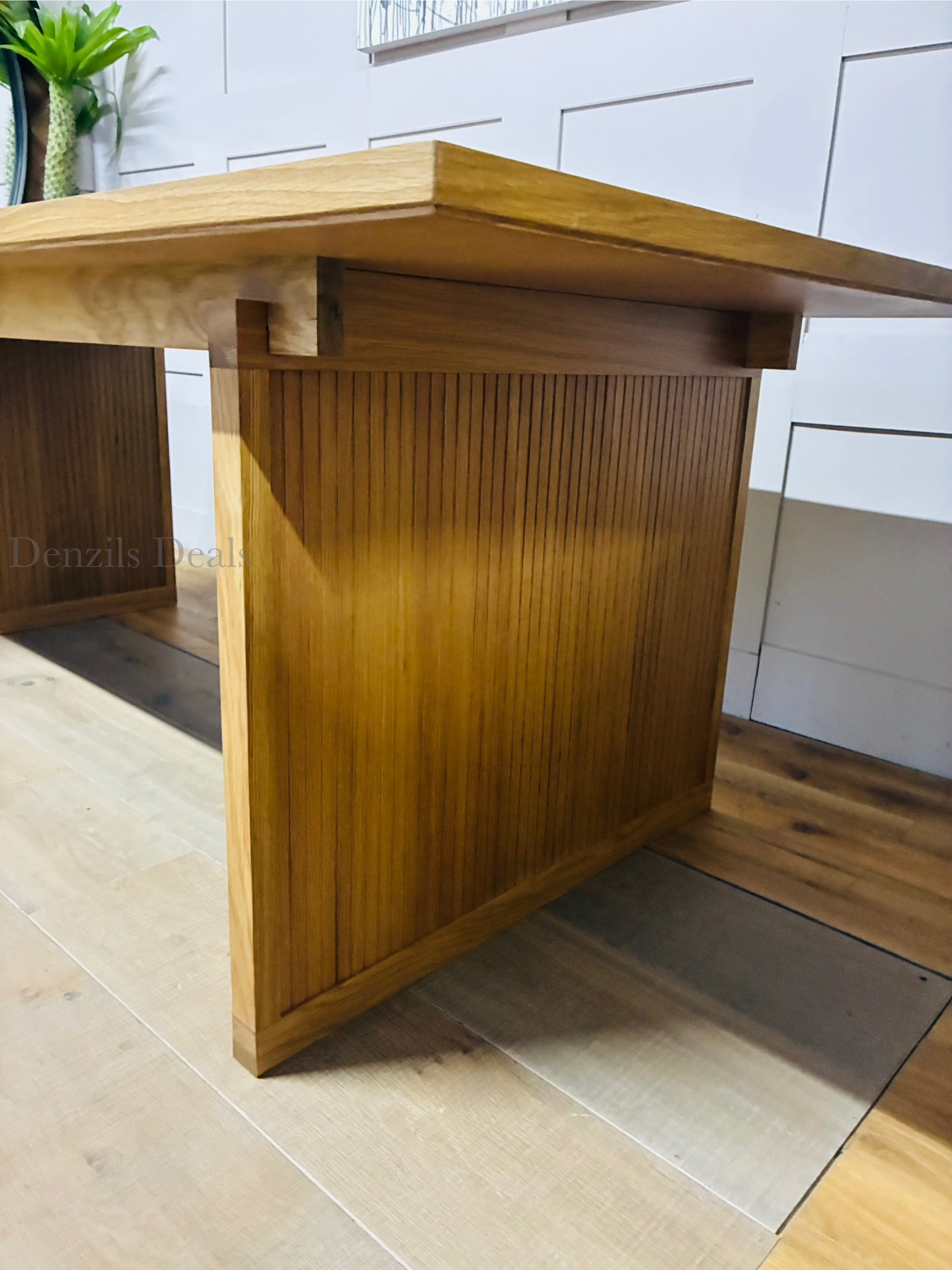 Modern Scandi-style oak dining table with eight seats, natural wood finish, and robust design ideal for contemporary dining rooms