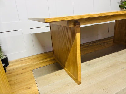 Modern Scandi-style oak dining table with eight seats, natural wood finish, and robust design ideal for contemporary dining rooms
