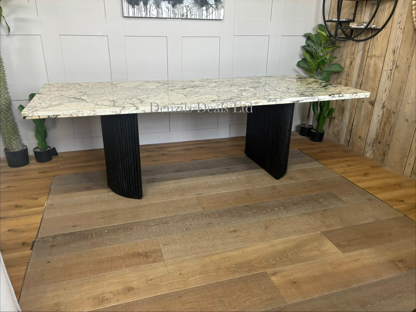 Modern dining room featuring the Anthropologie Renata marble top table with fluted wooden legs, 