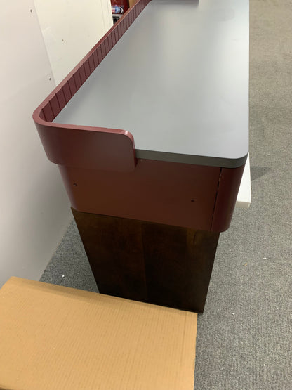 Modern home office setup featuring the Made.com Lali wide desk in grey and mahogany red.