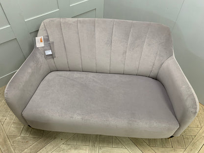 Modern living room styled with a John Lewis Meghan fluted back petite velvet sofa and dark legs