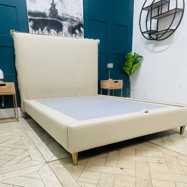 "Modern minimalist bedroom featuring the Appledore Upholstered Bed by Gallery Direct, styled with neutral bedding to highlight its clean lines and textured fabric seams