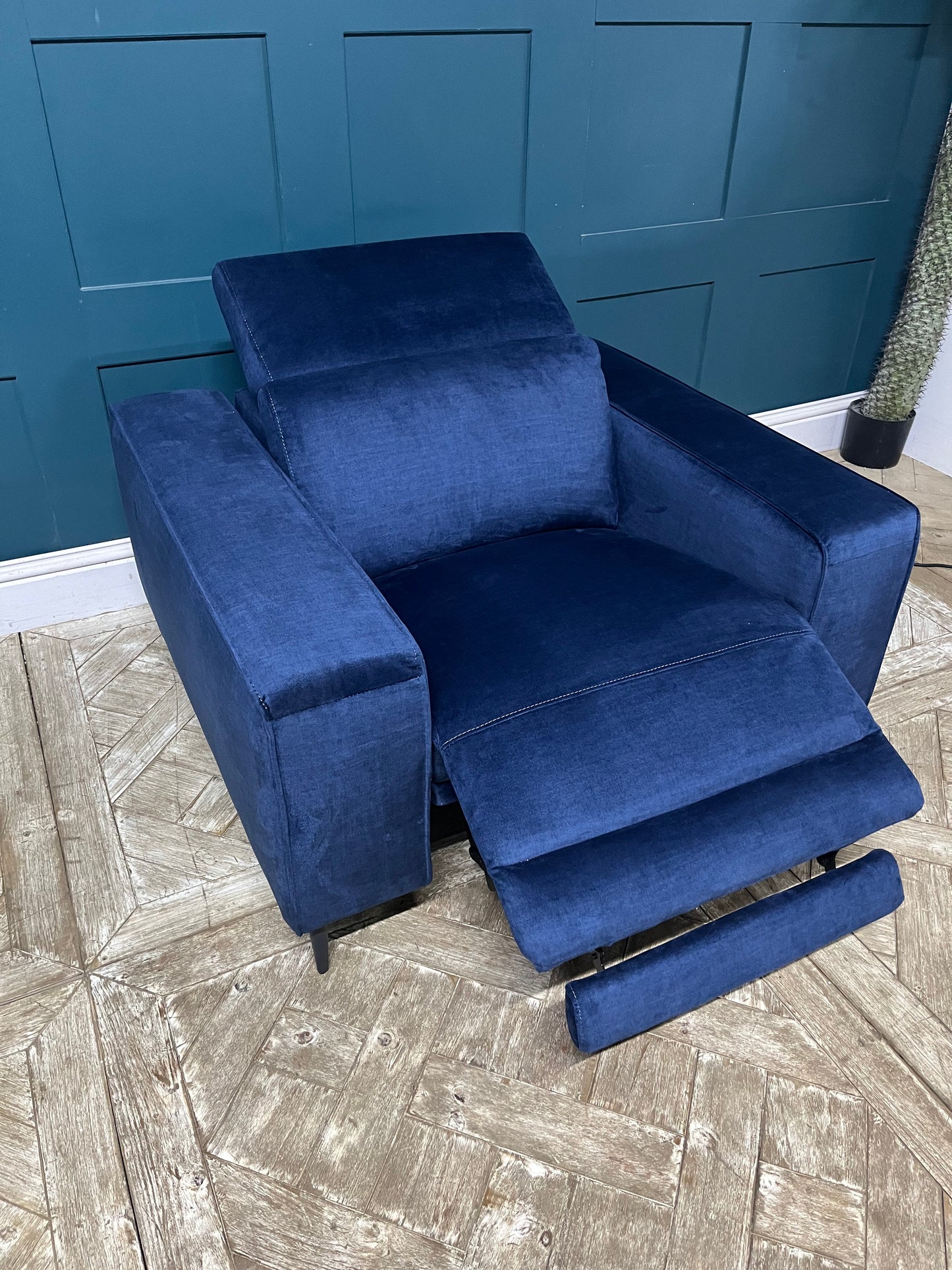 Modern navy blue chenille power recliner with contemporary metal legs for a living room