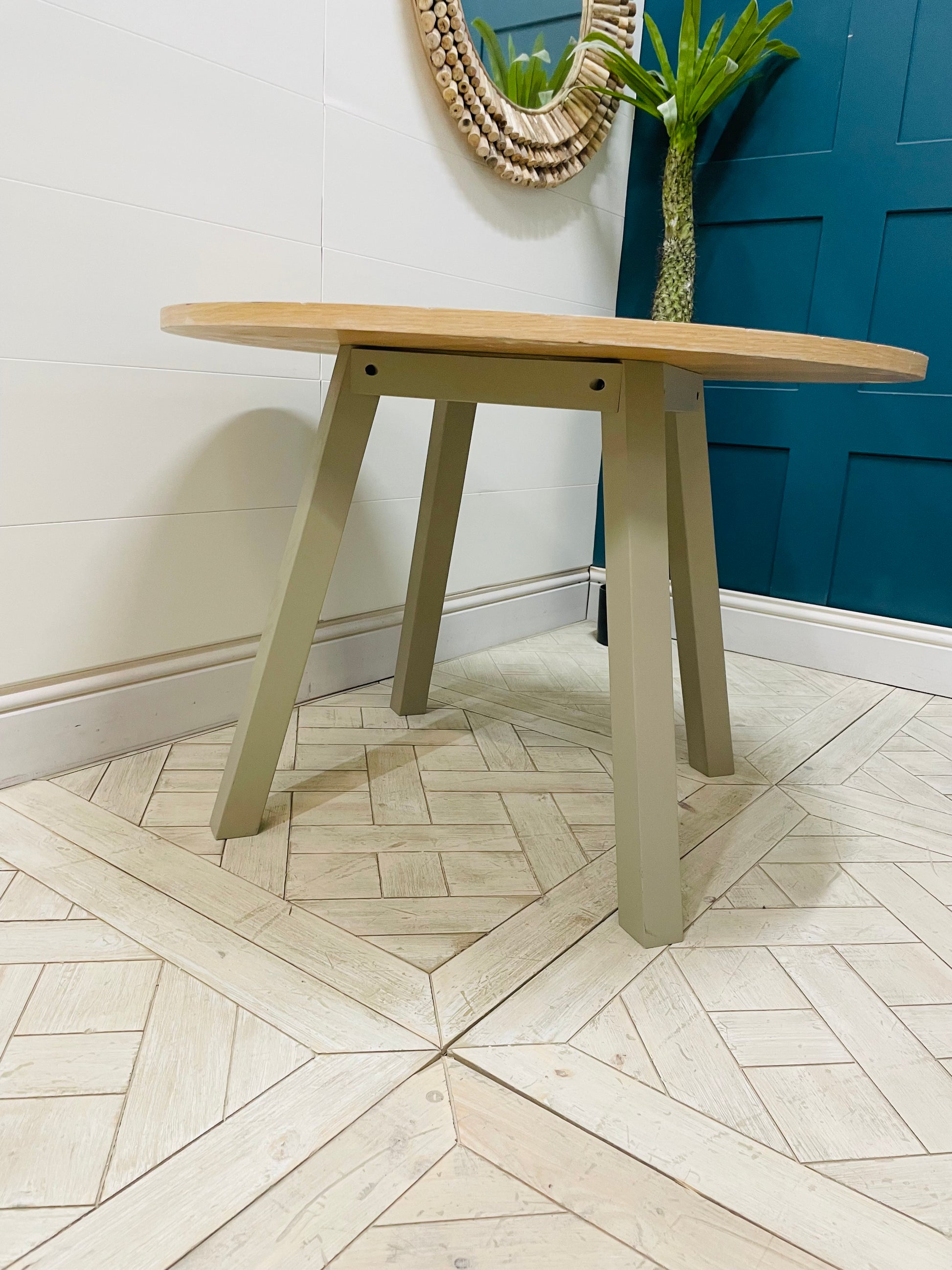 Modern round oak and grey dining table from the Eton collection by Gallery Direct. 