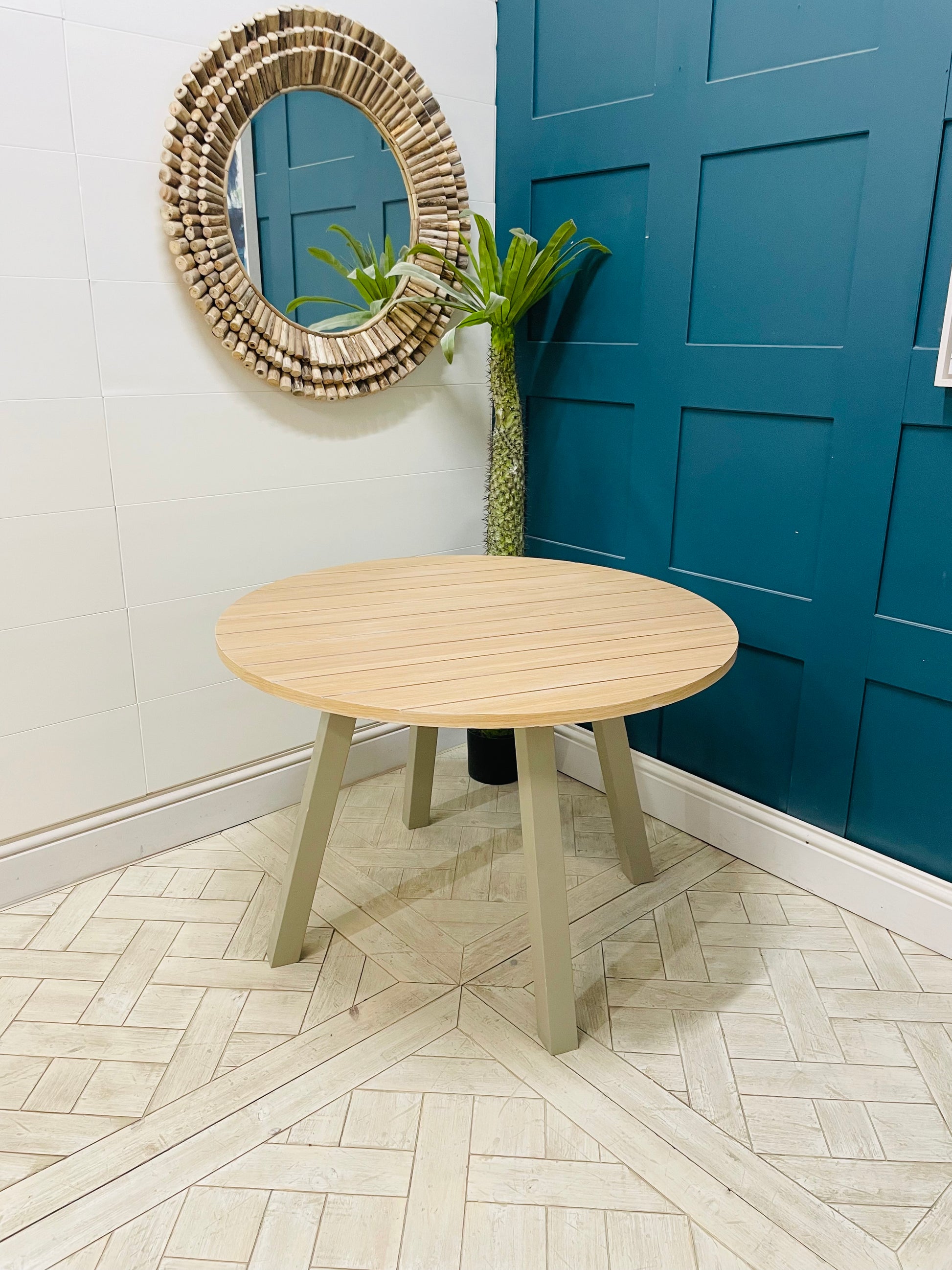 Modern round oak and grey dining table from the Eton collection by Gallery Direct. 