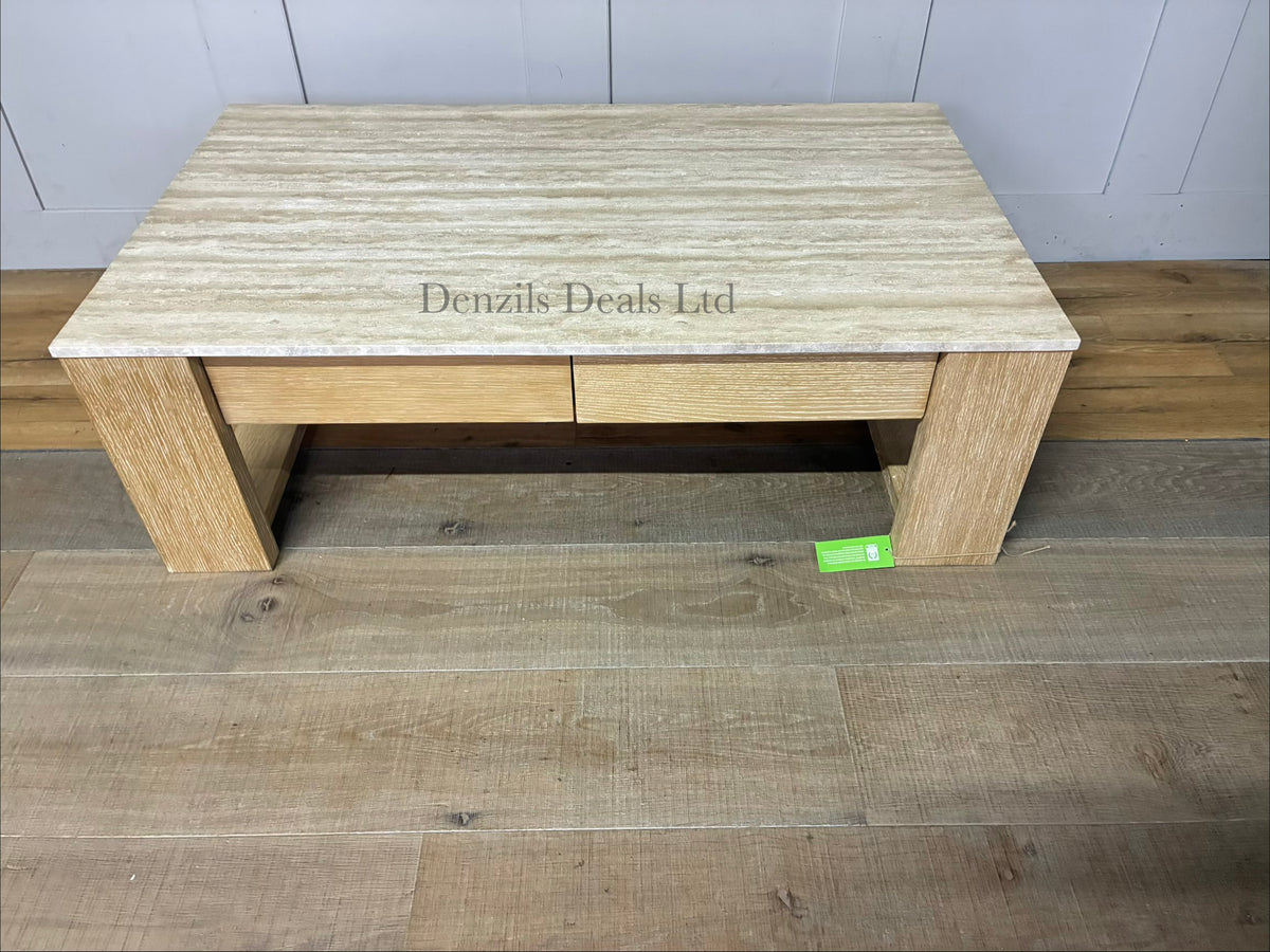 Modern rustic rectangular coffee table with a cream stone top, a grey-beige wood frame, and built-in drawers