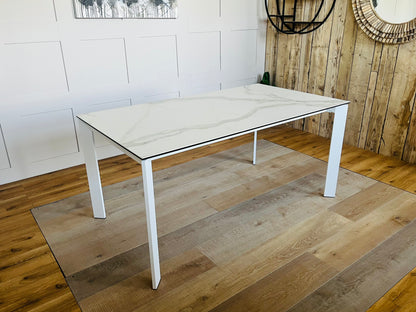 John lewis Modern white rectangular dining table with a smooth ceramic top and a lacquered metal frame, seating up to 6 people.