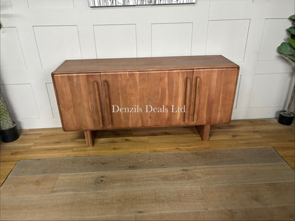 Natural acacia wood four-door sideboard with softly rounded edges, a vertical panelled design, and discreet cable holes at the back